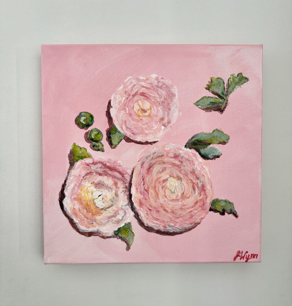 Painting of pink flowers with green leaves on a pink background. view of painting on wall.